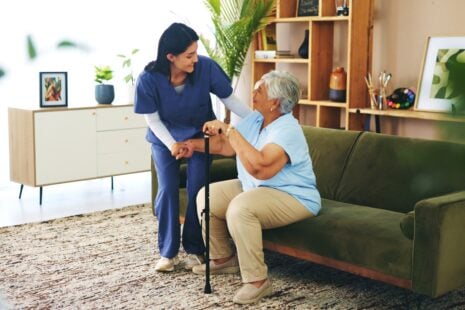 Nurse assisting senior resident in local Wichita nursing home