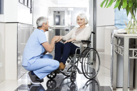 Senior woman with caregiver discussing assisted living versus long term care options in Wichita, Kansas